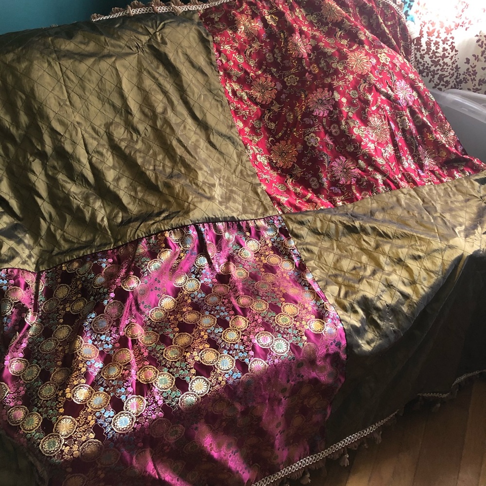Silky throw. Looks Indian.